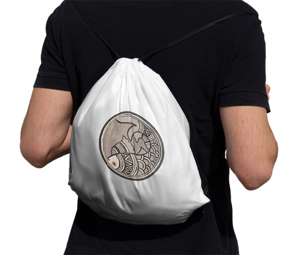 Man carrying Madhubani Art Fish Drawstring Bag White